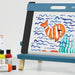 artPOP! Kids 3-in-1 Tabletop Easel - Ocean Blue, rainbow artwork complete on tabletop easel