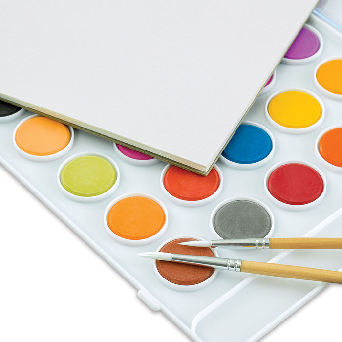 artPOP! Watercolor Kit (Close-up of watercolors, watercolor paper pad, and two paintbrushes)